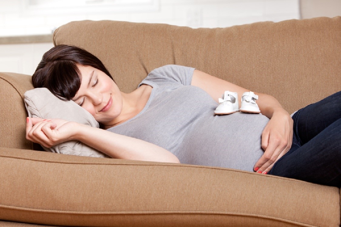 Pregnant Mother Resting on Sofa