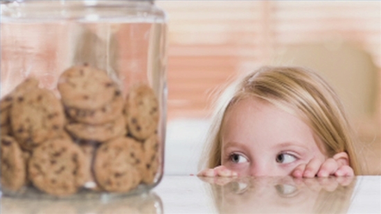 lying child eyeing cookie jar