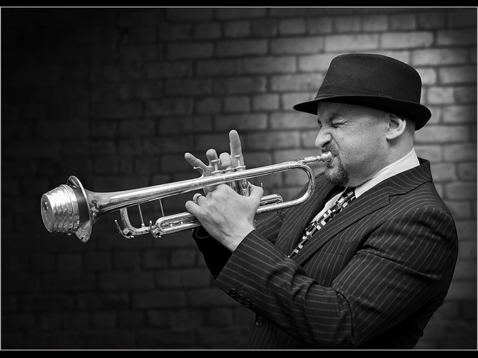 musician morris alan playing trumpet
