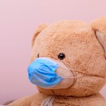 Teddy Bear wearing a face mask to protect against COVID-19 spread