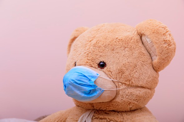 Teddy Bear wearing a face mask to protect against COVID-19 spread