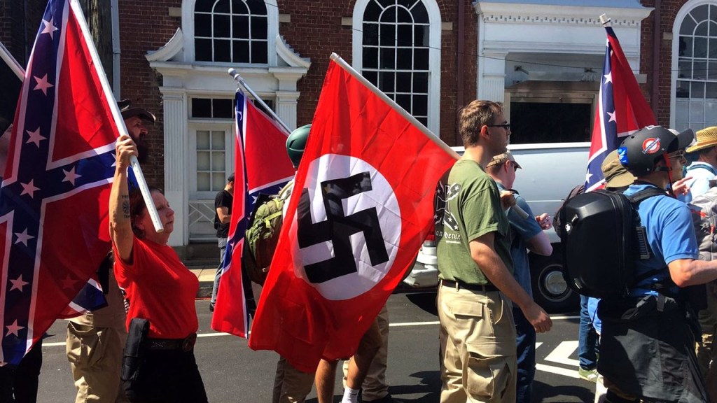 Fuck Neo-Nazis. People carrying confederate and Nazi flags (so the same fucking flag basically).