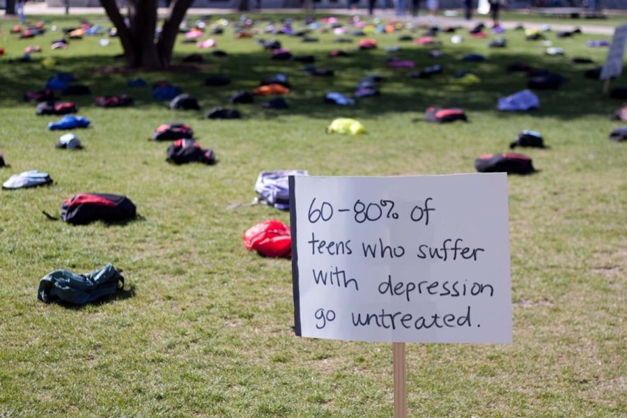 Send silence packing display showing a sign saying 60-80% of teens who suffer with depression go untreated.